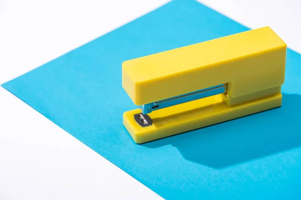 High angle view of stapler and paper isolated on white — Stock Photo