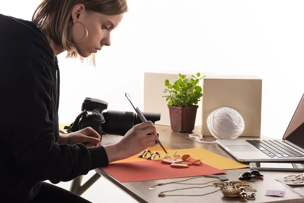 Photographer making composition with accessories for photo shooting — Stock Photo