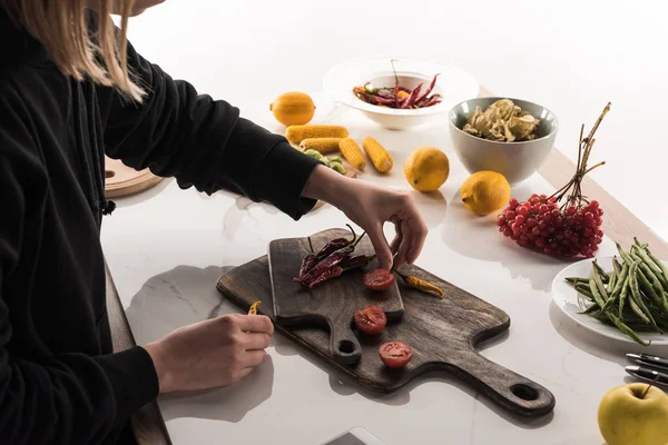 Cropped view of commercial female photographer making food composition for photo shoot — Stock Photo