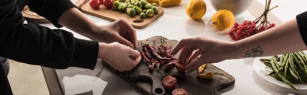 Cropped view of photographers making food composition for photo shoot — Stock Photo