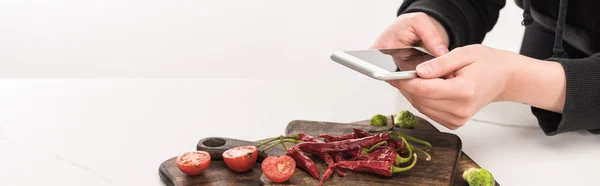 Cropped view of photographer making food composition for commercial photography on smartphone — Stock Photo