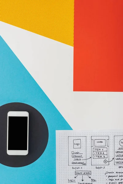 Top view of smartphone and website design template on abstract geometric background — Stock Photo