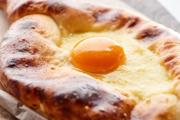 Close up view of egg yolk on adjarian khachapuri — Stock Photo