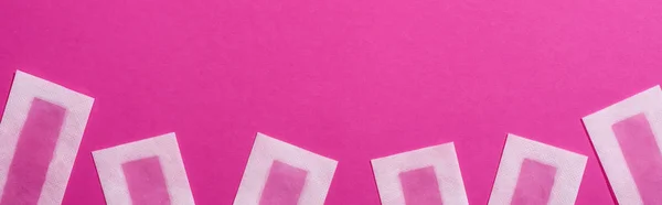 Top view of female depilation wax stripes on pink background, panoramic shot — Stock Photo