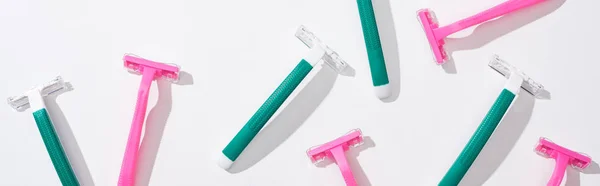 Flat lay with green disposable razors on white background — Stock Photo