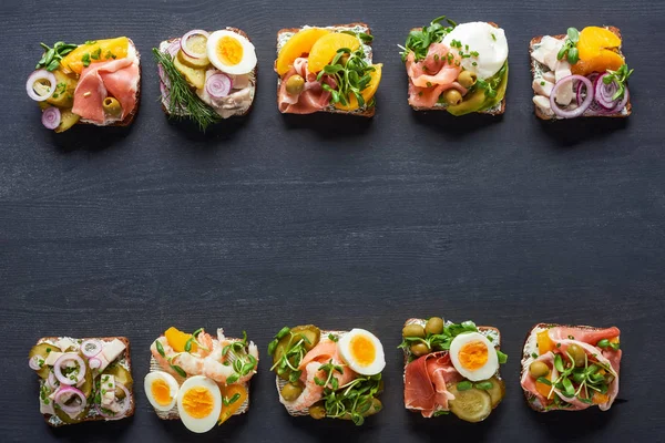 Top view of delicious danish smorrebrod sandwiches on grey surface — Stock Photo