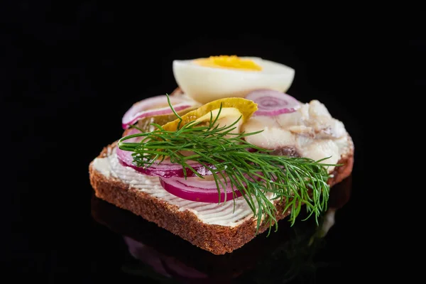 Selective focus of dill on delicious danish smorrebrod sandwich on black — Stock Photo
