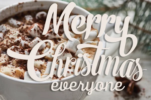 Close up view of Christmas cacao with marshmallow and cacao powder in mug with merry Christmas everyone lettering — Stock Photo