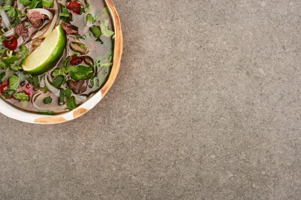 Top view of pho in bowl on grey background — Stock Photo