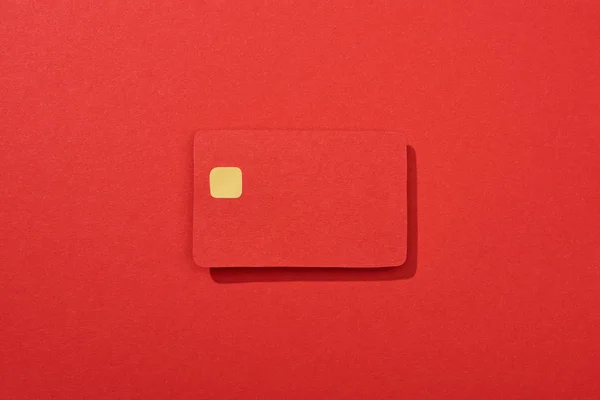 Top view of colorful empty credit card on red background — Stock Photo