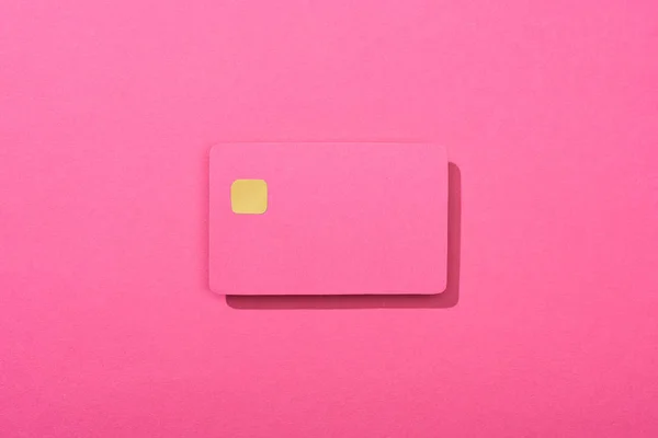 Top view of colorful empty credit card on pink background — Stock Photo