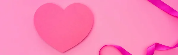 Top view of empty paper heart with ribbon isolated on pink, panoramic shot — Stock Photo