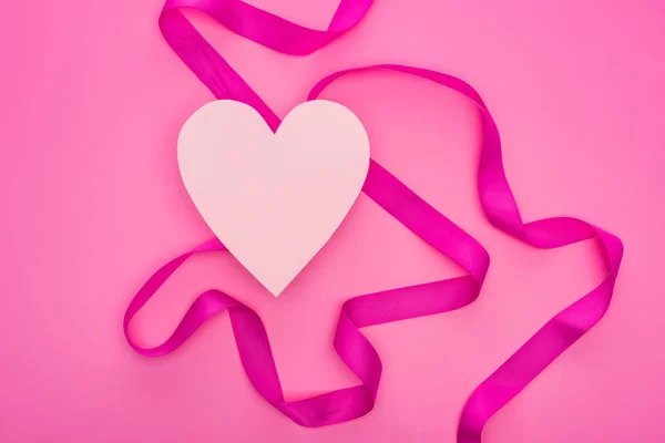 Top view of empty paper heart with ribbon isolated on pink — Stock Photo
