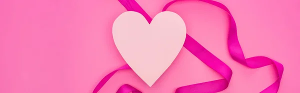 Top view of empty paper heart with ribbon isolated on pink, panoramic shot — Stock Photo