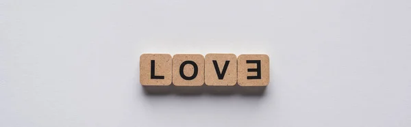 Top view of cubes with love lettering on white background, panoramic shot — Stock Photo