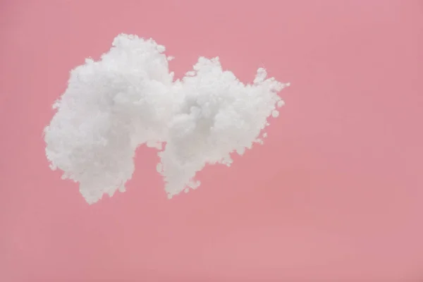 White fluffy cloud made of cotton wool isolated on pink — Stock Photo