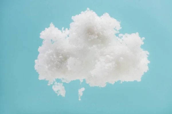 White fluffy cloud made of cotton wool isolated on blue background — Stock Photo