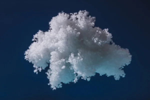 White fluffy cloud made of cotton wool isolated on dark blue — Stock Photo