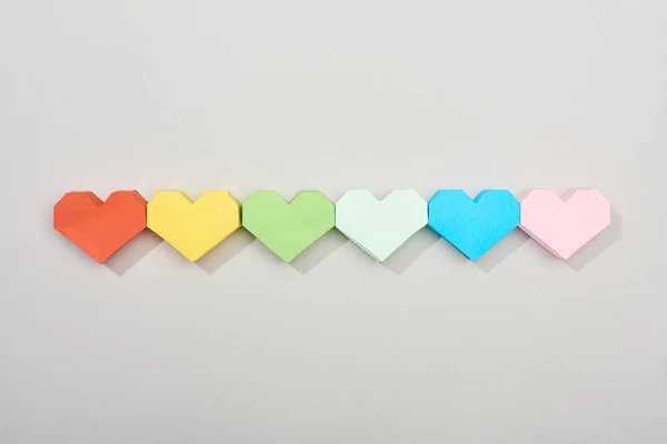 Top view of paper hearts on grey background — Stock Photo