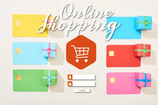 Top view of multicolored empty credit cards and gift boxes on white background with online shopping illustration — Stock Photo