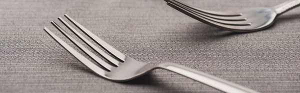 Selective focus of two forks of grey tablecloth, panoramic shot — Stock Photo