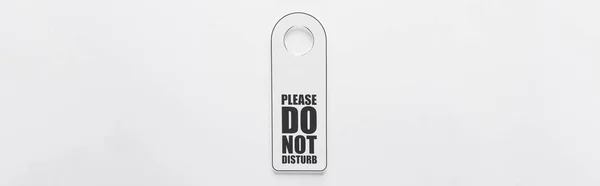 Top view of please do no disturb sign on white background, panoramic shot — Stock Photo