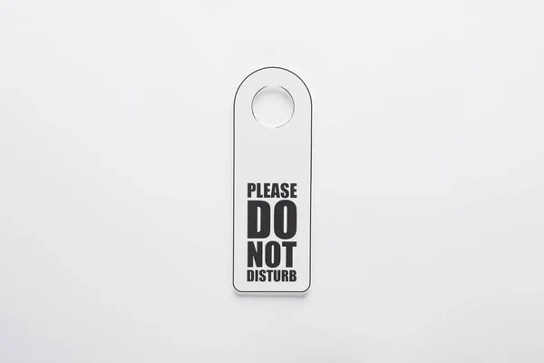 Top view of please do no disturb sign on white background — Stock Photo