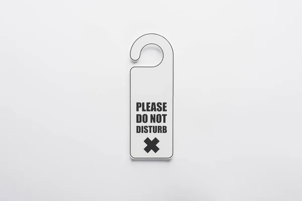 Top view of please do no disturb sign on white background — Stock Photo