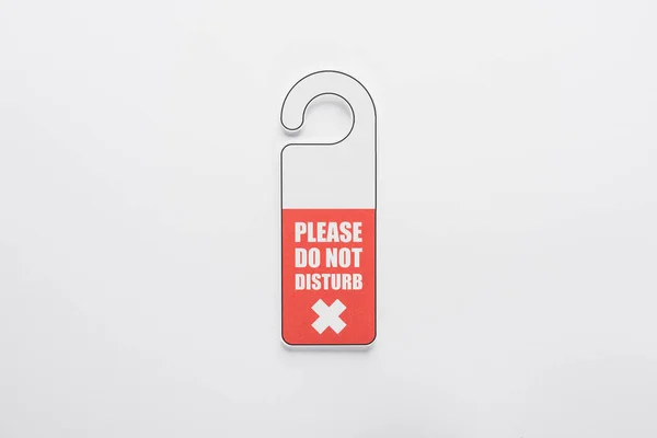 Top view of please do no disturb sign on white background — Stock Photo