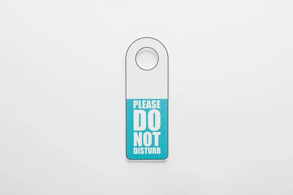 Top view of please do no disturb sign on white background — Stock Photo