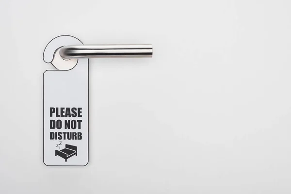 Please do no disturb sign on handle on white background — Stock Photo