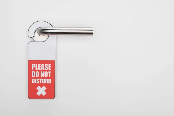 Please do no disturb sign on handle on white background — Stock Photo