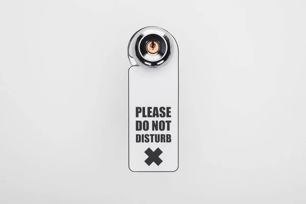 Please do no disturb sign on handle with lock on white background — Stock Photo