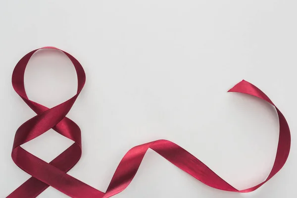 Top view of red silk ribbon as number 8 isolated on white — Stock Photo