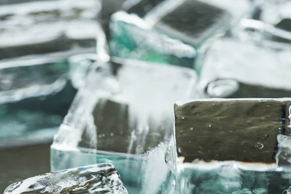 Close up view of melting transparent clear square ice cubes — Stock Photo