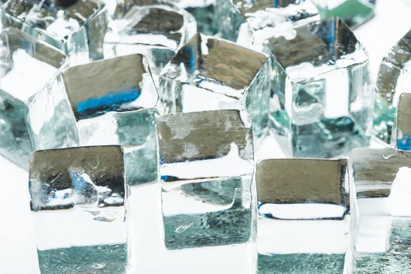 Close up view of melting transparent clear square ice cubes — Stock Photo