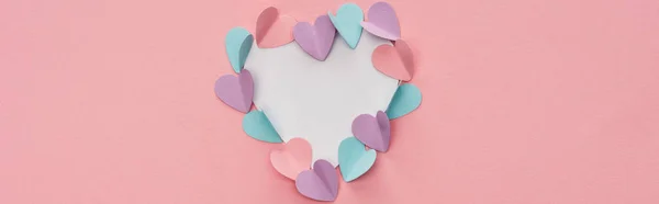 Top view of colorful paper hearts as frame on pink background, panoramic shot — Stock Photo