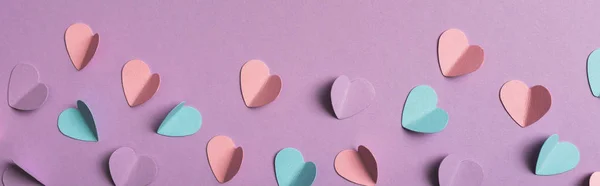 Top view of colorful paper hearts on violet background, panoramic shot — Stock Photo