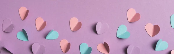 Top view of colorful paper hearts on violet background, panoramic shot — Stock Photo