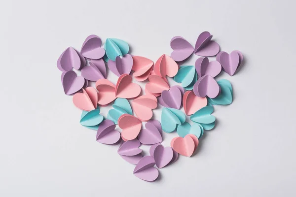 Top view of small paper hearts on white background — Stock Photo