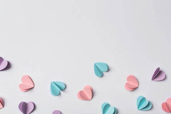 Top view of small paper hearts on white background — Stock Photo