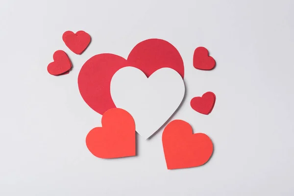 Top view of red hearts on white background — Stock Photo