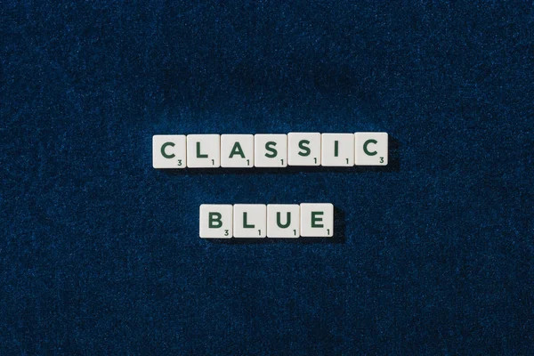 Top view of classic blue lettering on cubes on blue velour background — Stock Photo