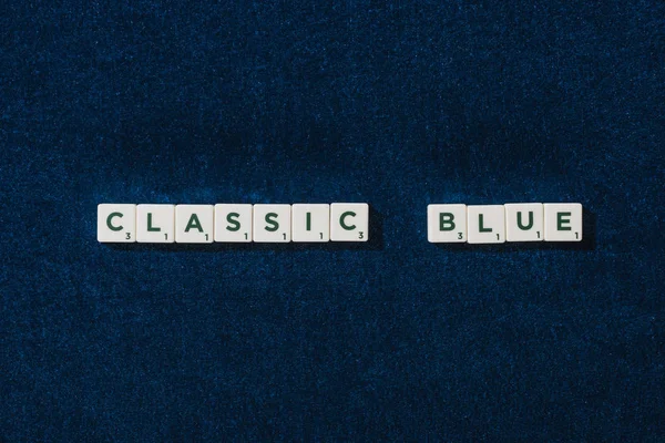 Top view of classic blue lettering on cubes on blue velour background — Stock Photo