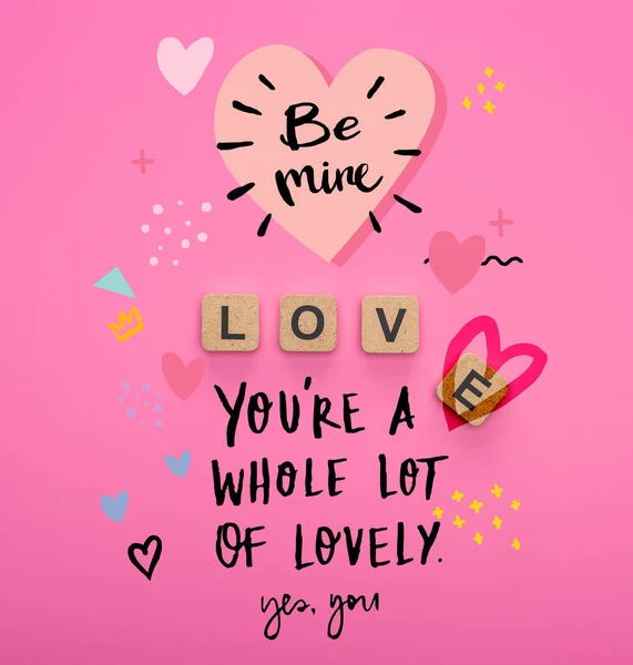 Top view of love lettering on wooden cubes on pink background with be mine and you are a whole lot of lovely illustration — Stock Photo