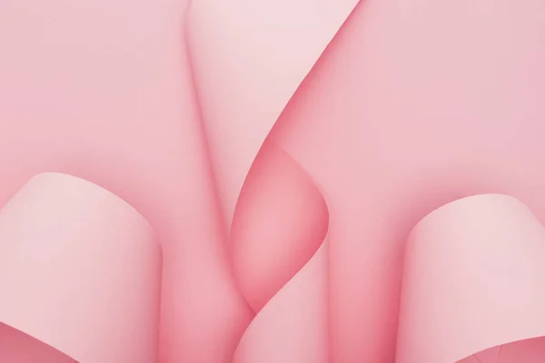 Top view of pink paper swirls on pink background — Stock Photo