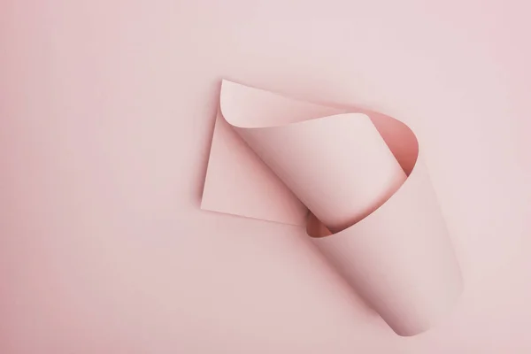 Top view of pink paper swirl on pink background — Stock Photo