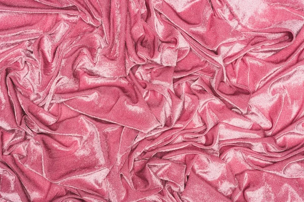 Vue du dessus du fond du textile froissé en velours rose — Photo de stock