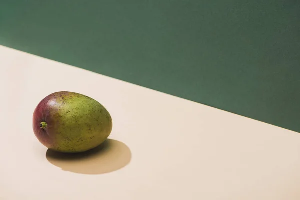 Fresh mango on green and white background — Stock Photo