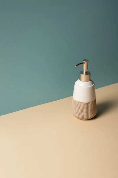 Liquid soap dispenser on beige and grey, zero waste concept — Stock Photo